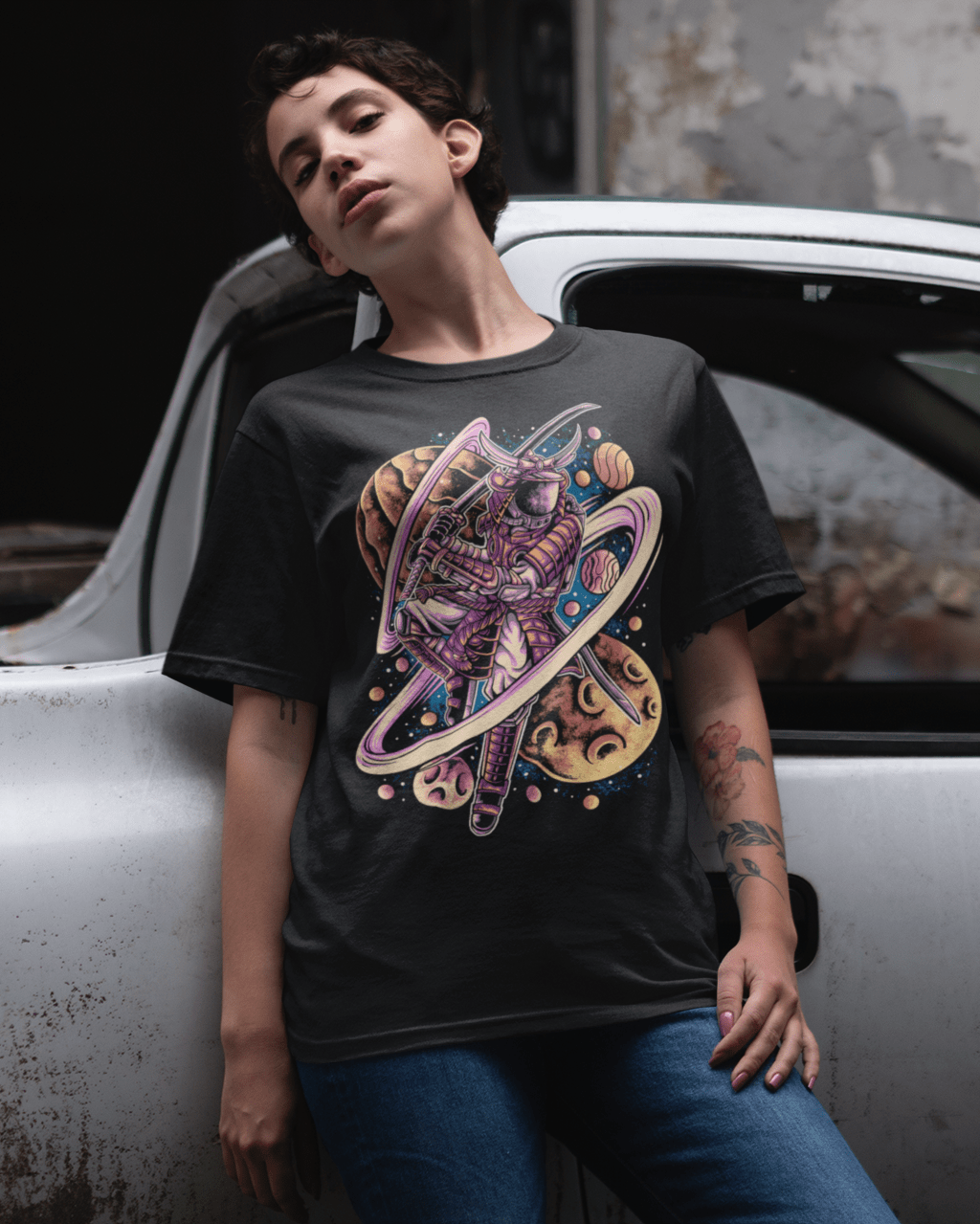 Astro-Samurai-mockup-of-a-girl-wearing-a-unisex-tshirt-leaning-against-an-old-car