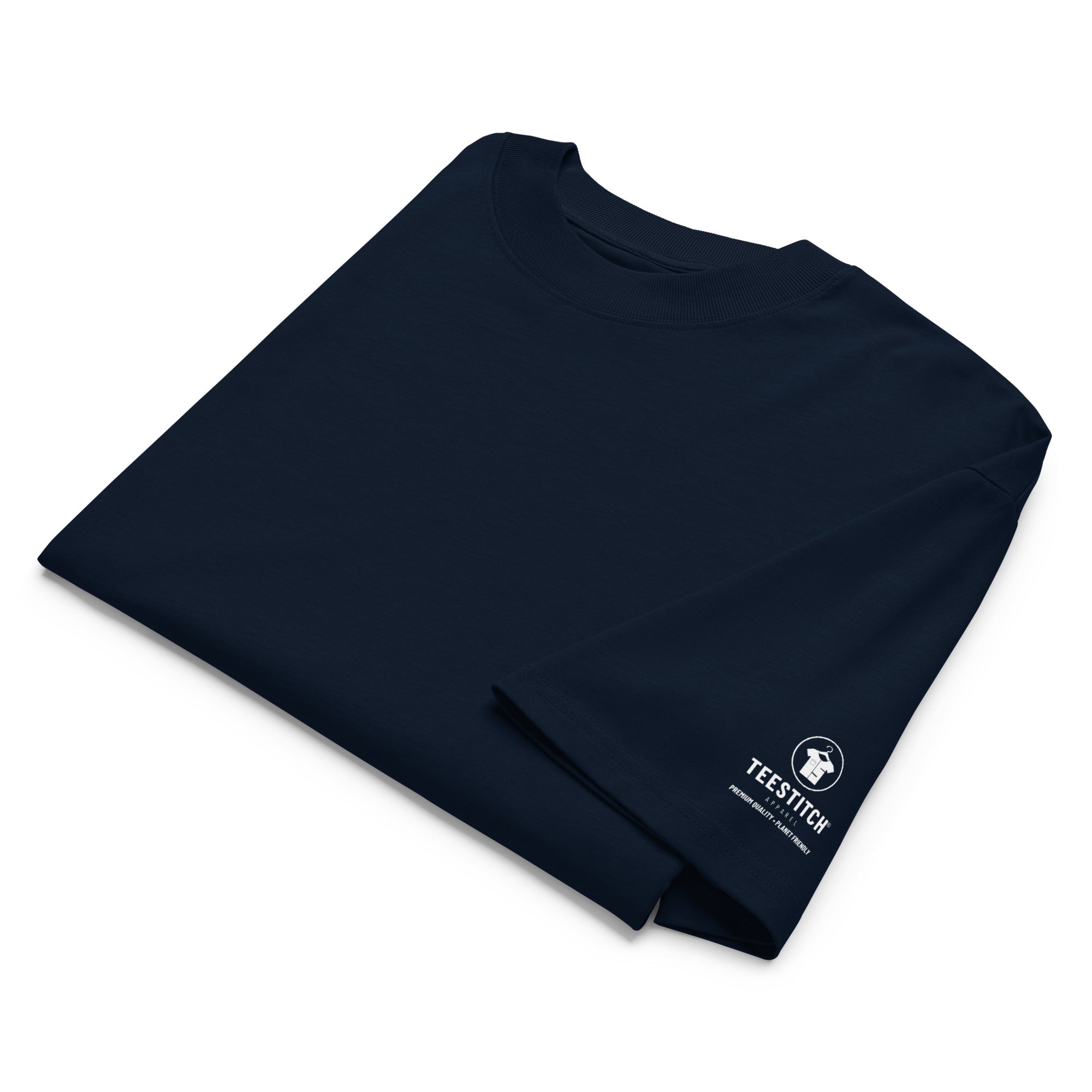 Folded navy blue t-shirt with 'Teestitch' logo on a white background