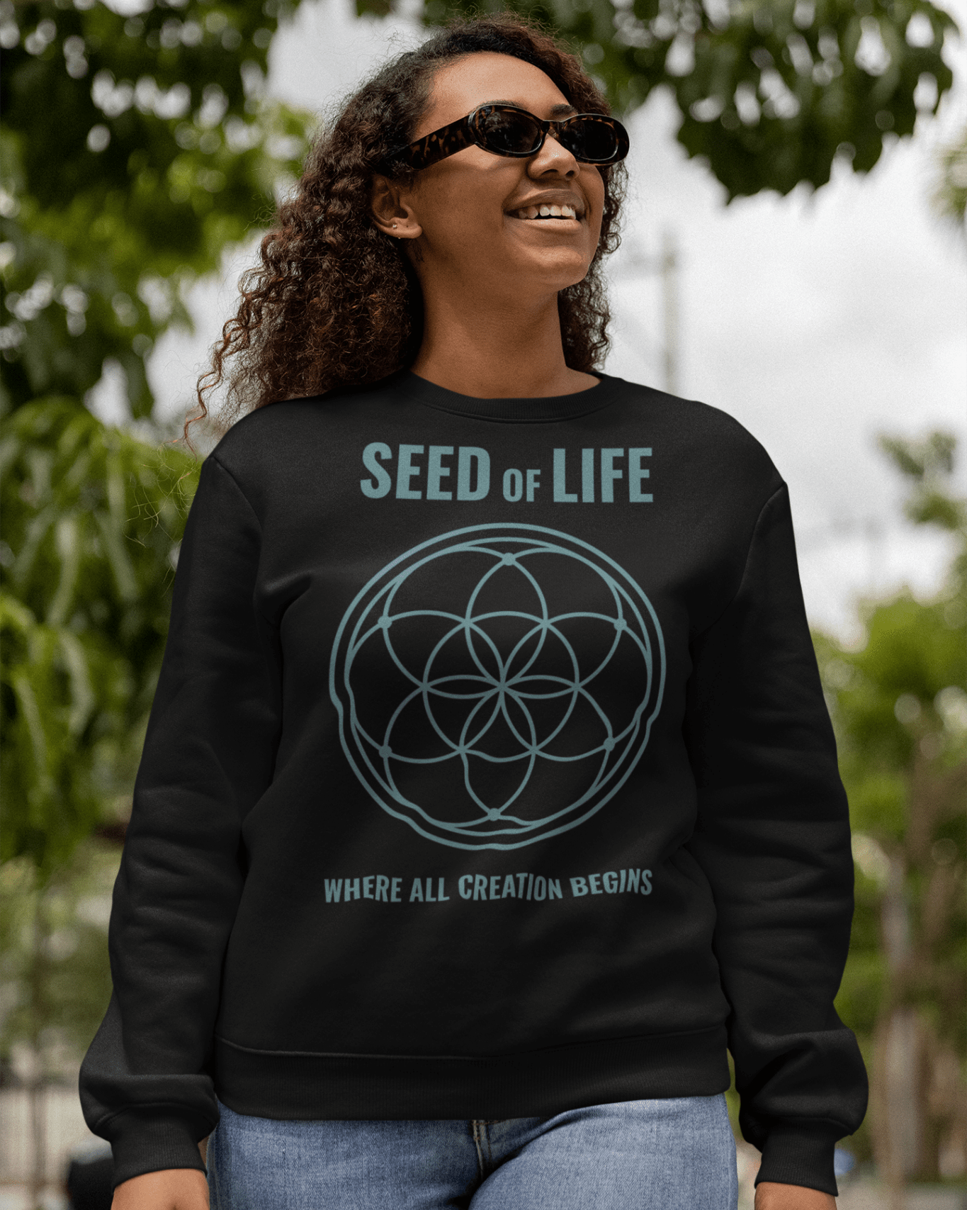 seed-of-life-crewneck-sweatshirt-mockup-of-a-smiling-woman-with-sunglasses