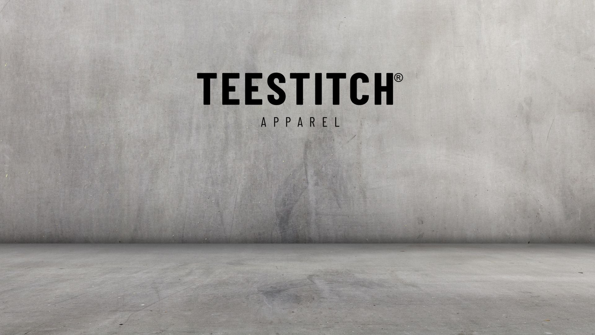 TeeStitch Apparel logo on concrete wall 