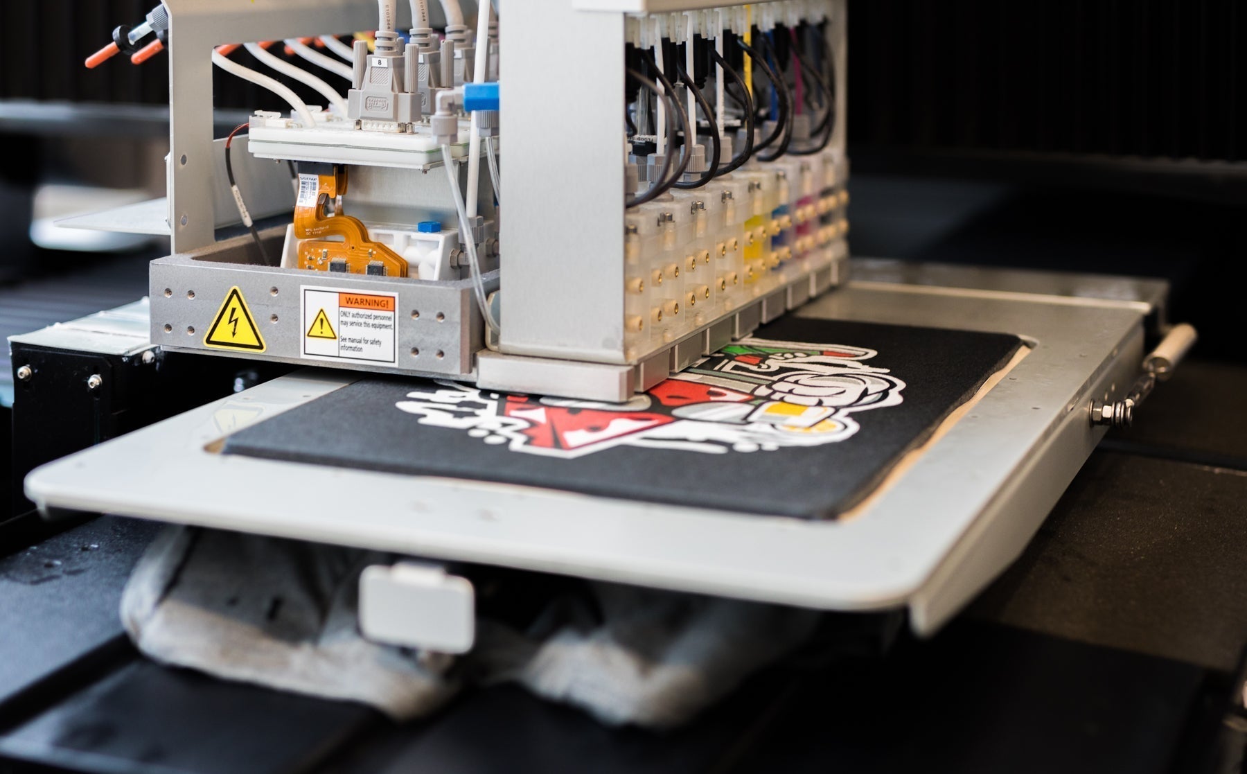 DTG printer printing a design on fabric.