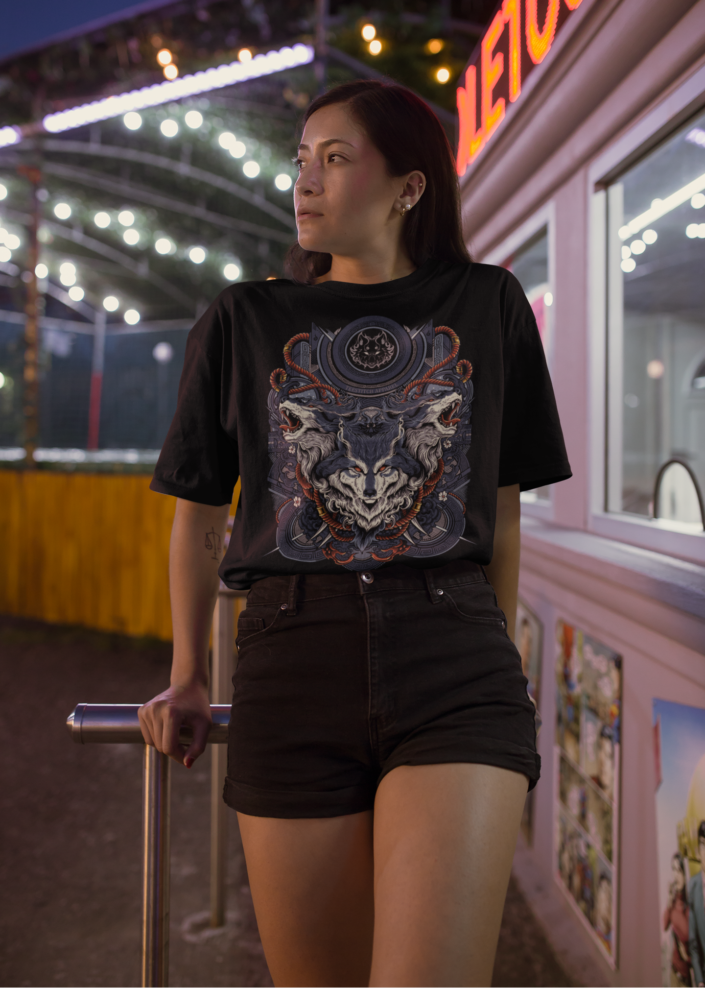 Wolf-Squadmockup-of-a-woman-wearing-a-unisex-t-shirt-at-a-fair-admission-booth-TeeStitch-Apparel