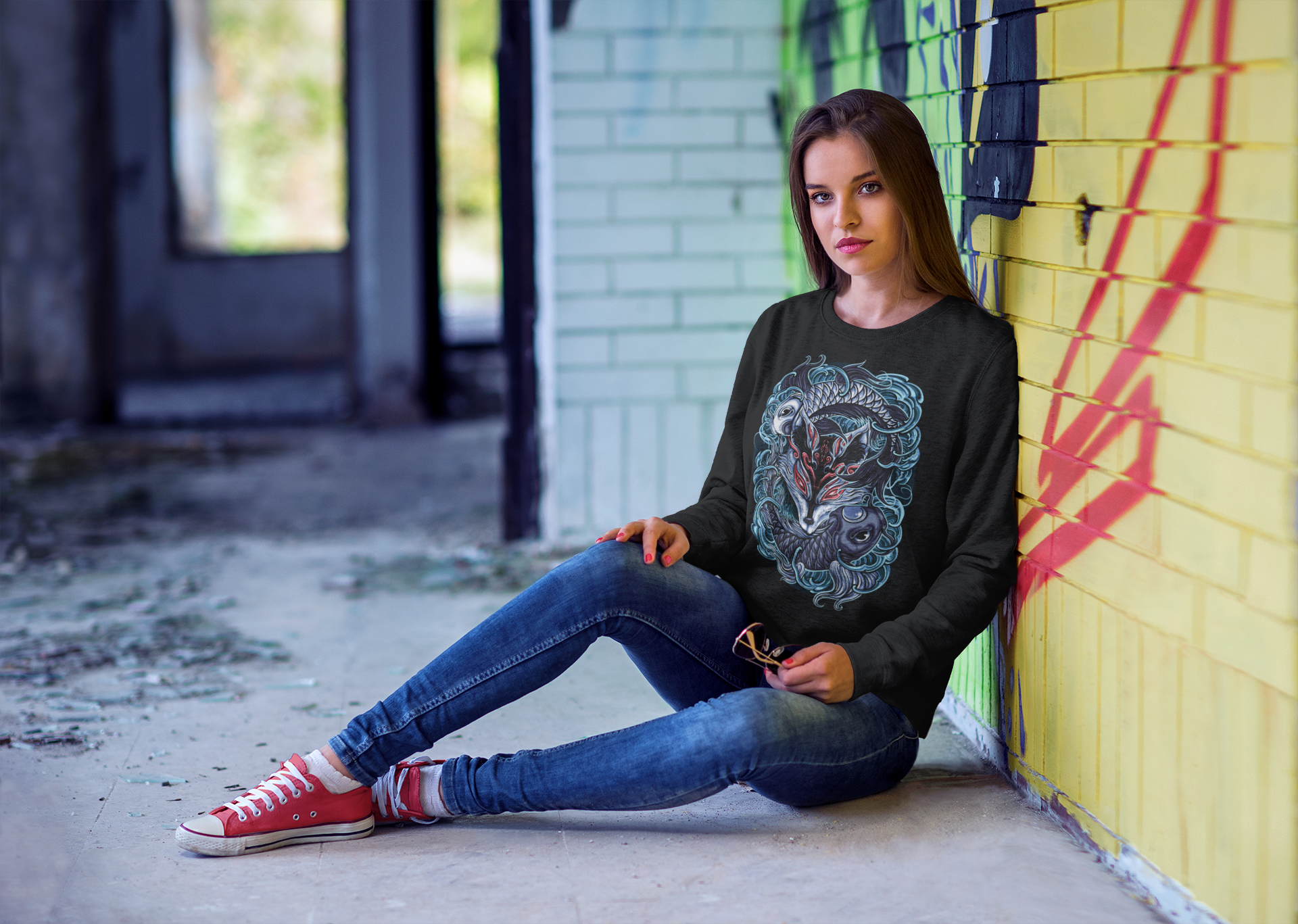 crewneck-sweatshirt-mockup-of-a-woman-sitting-against-a-graffiti-wall