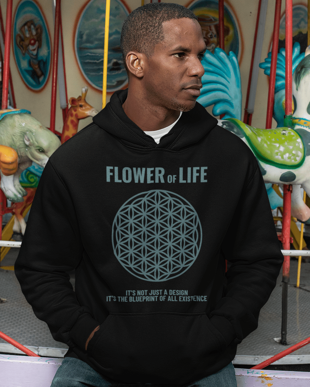 flower-of-life-mockup-of-a-man-wearing-a-pullover-hoodie-at-a-carousel