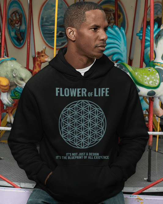 flower-of-life-mockup-of-a-man-wearing-a-pullover-hoodie-at-a-carousel