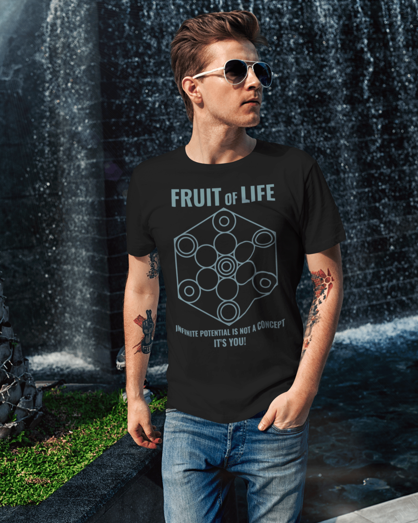 fruit-of-life-t-shirt-mockup-of-a-cool-man-walking-by-a-fountain