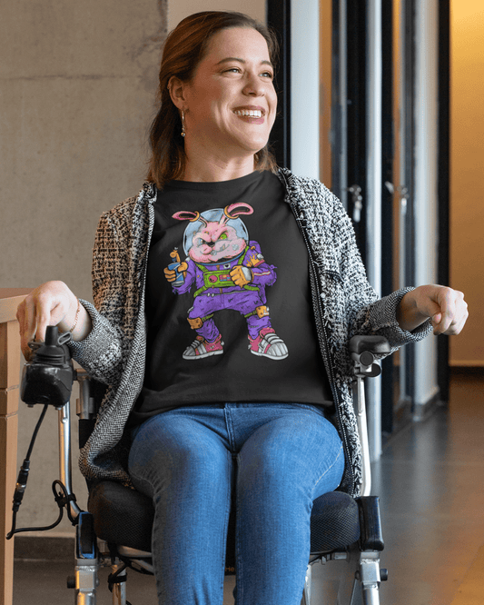 Space-_Rabbit-t-shirt-mockup-of-a-smiling-woman-using-a-wheelchair-in-a-hall