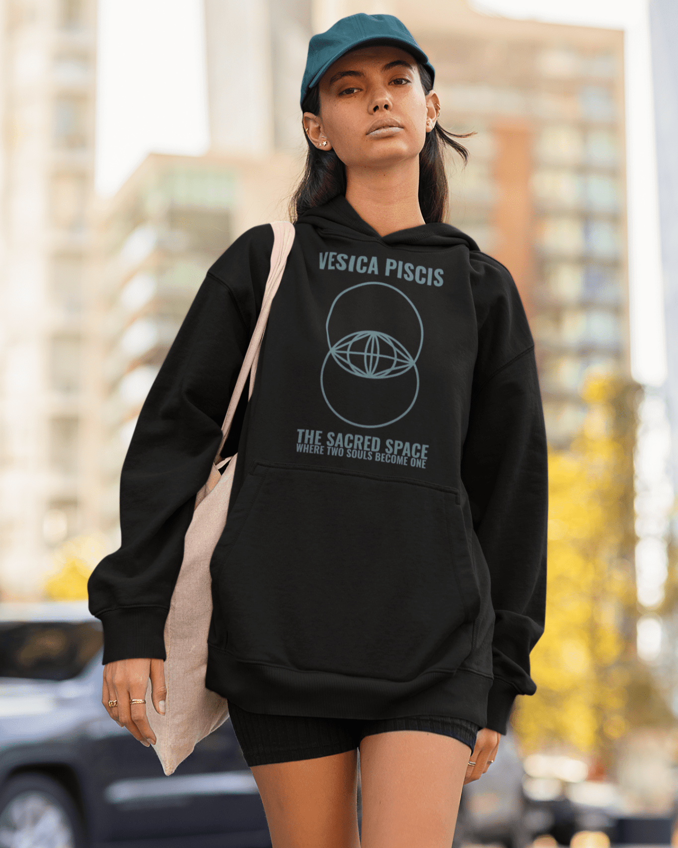 vesica-piscis-mockup-of-a-cool-looking-woman-wearing-an-oversized-hoodie